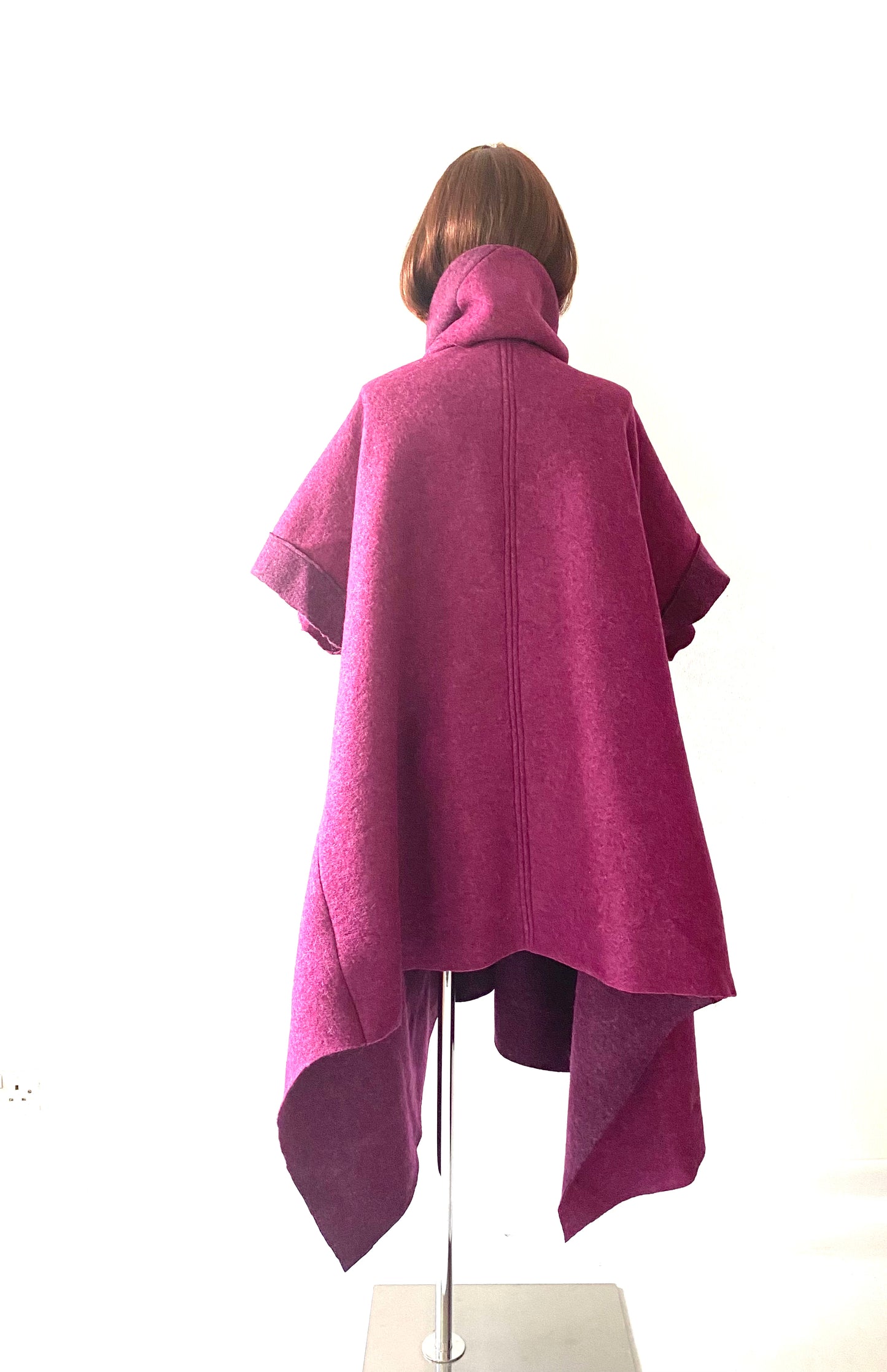 “Woolen Splendor: Embrace Asymmetry with this woollen  coat made in wool