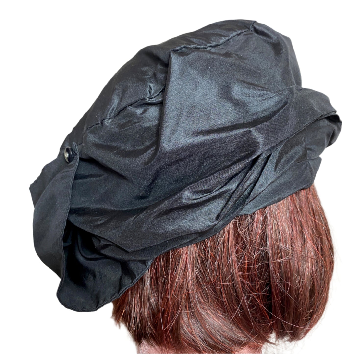 Elegant silk taffeta turban with a luxurious sheen, designed for a sophisticated and stylish look. Perfect for special occasions or adding a chic touch to everyday outfits.