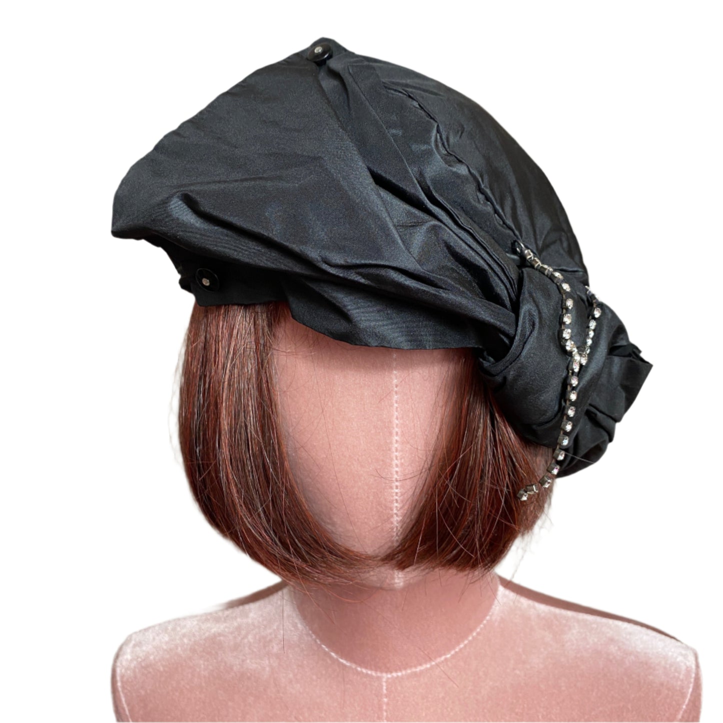 Elegant silk taffeta turban with a luxurious sheen, designed for a sophisticated and stylish look. Perfect for special occasions or adding a chic touch to everyday outfits.