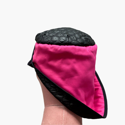 Handmade vintage-style,in mix fibres  hot pink and black fabric,with structured brim and elegant trim, perfect for classic and timeless fashion.