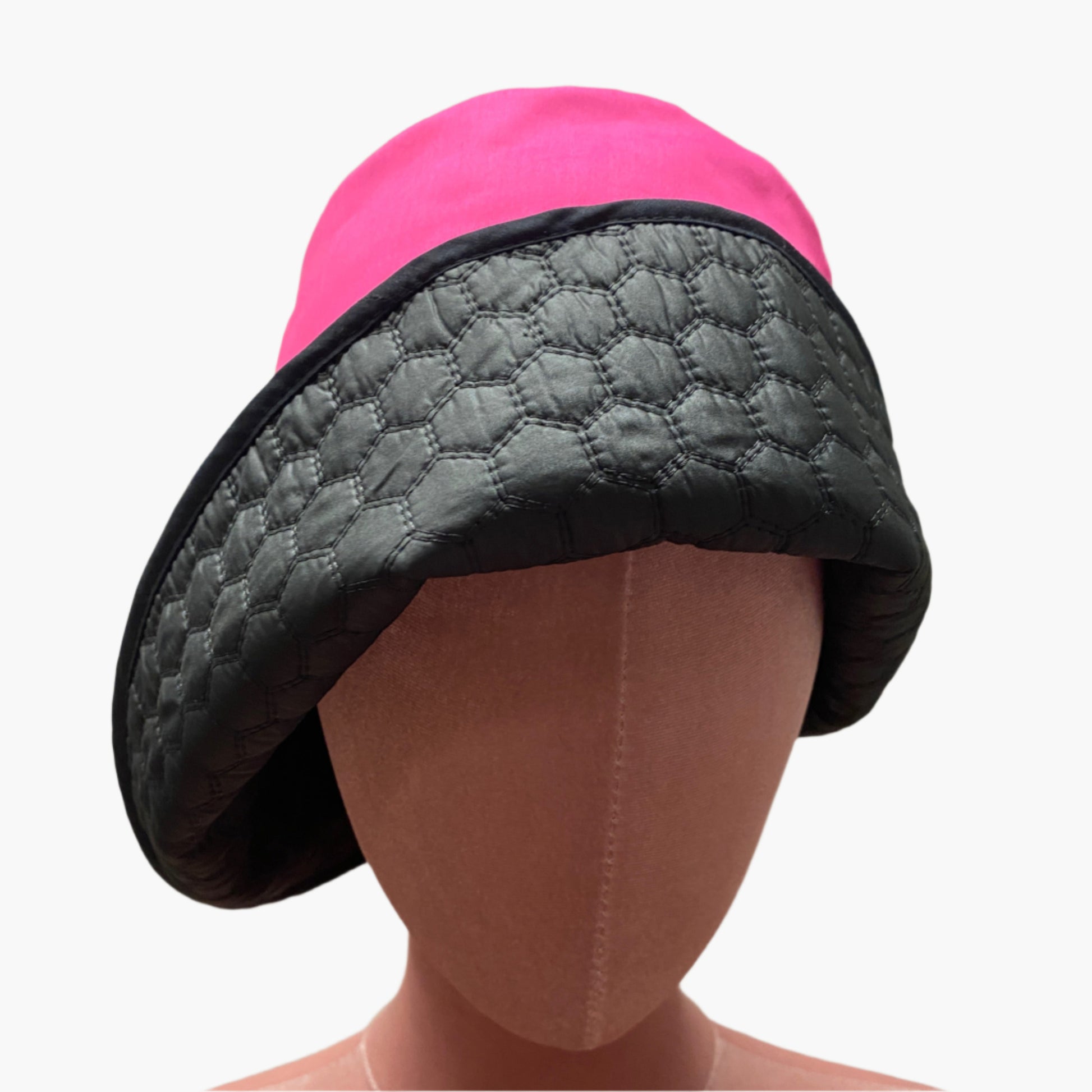 Handmade vintage-style,in mix fibres  hot pink and black fabric,with structured brim and elegant trim, perfect for classic and timeless fashion.