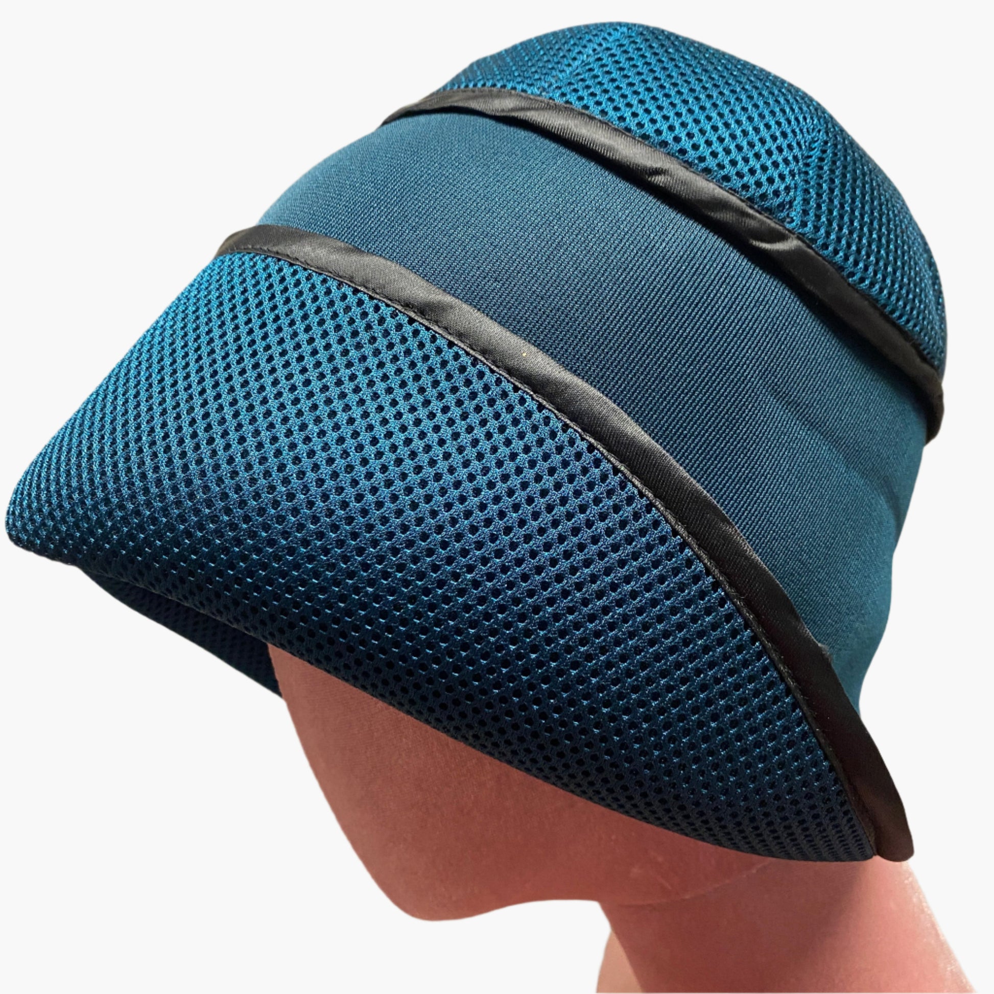 Handmade vintage-style,in petrol blue neoprene fabric,with structured brim and elegant trim, perfect for classic and timeless fashion.
Also will keep your head warm 