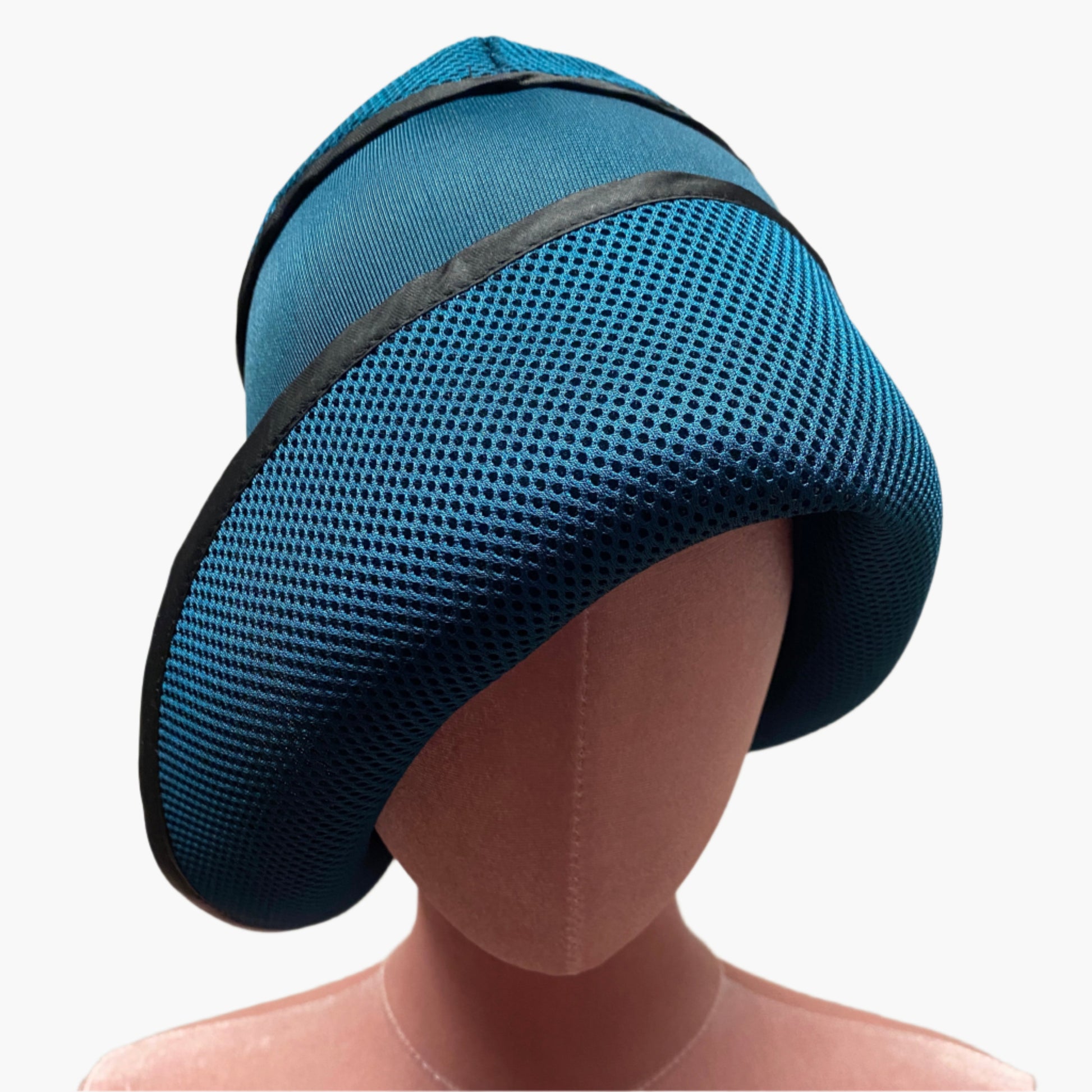 Handmade vintage-style,in petrol blue neoprene fabric,with structured brim and elegant trim, perfect for classic and timeless fashion.