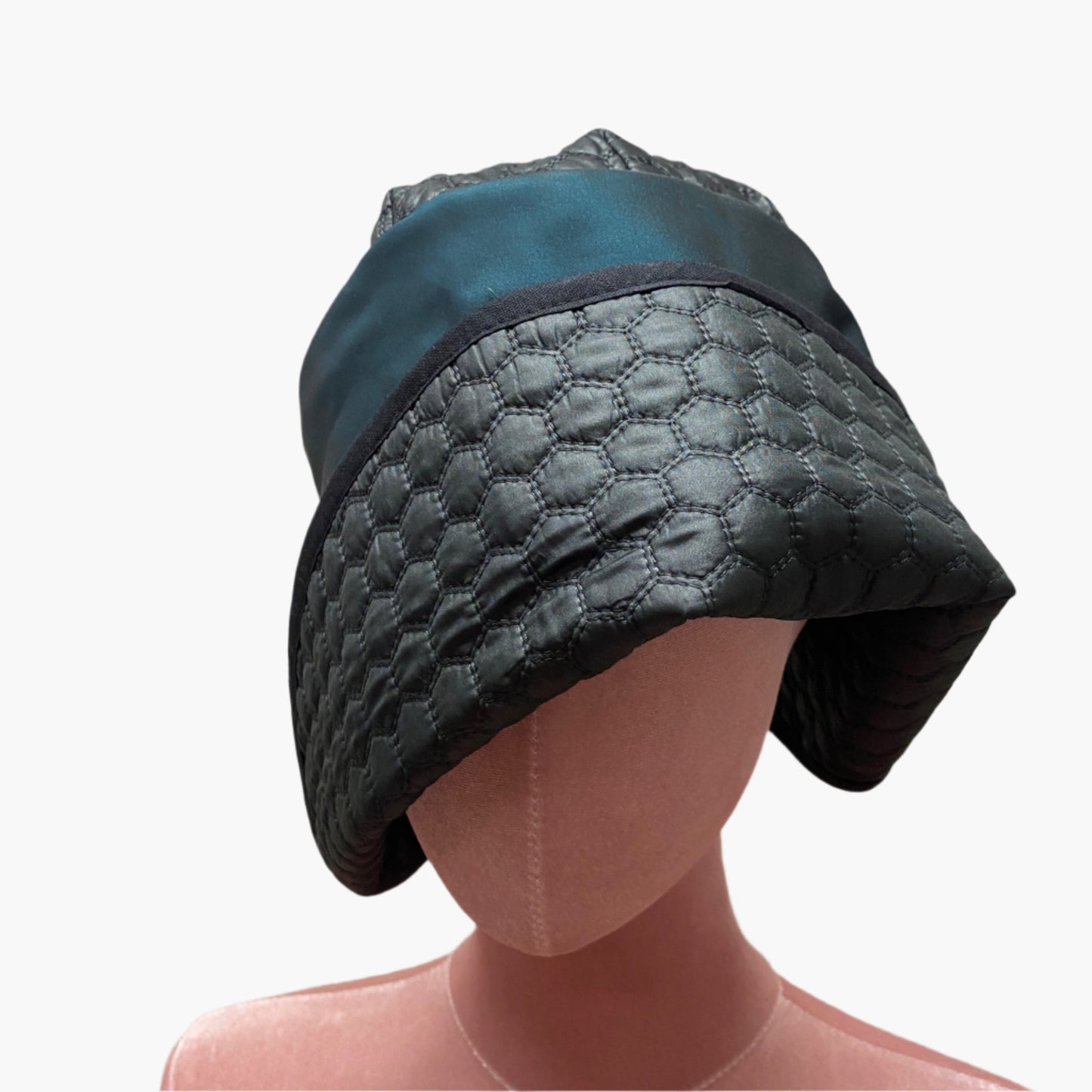 Handmade vintage-style,in petrol blue waterproof fabric,with structured brim and elegant trim, perfect for classic and timeless fashion.